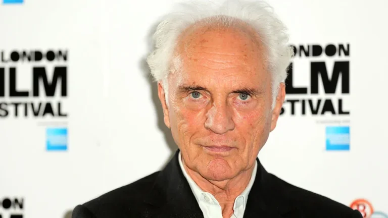 Terence Stamp in a sharp suit, his piercing gaze and sculpted features illuminated by soft studio light, capturing the timeless charisma of the man who brought General Zod and countless unforgettable characters to life