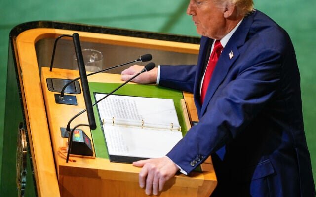 Trump UN speech 2025 at UN podium, top-down view with teleprompter and binder